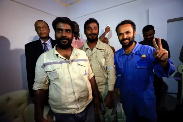 
          Three foreign oil workers kidnapped by rebels in South Sudan smile as they arrive after being released at Khartoum Airport, Sudan, March 30, 2017
        