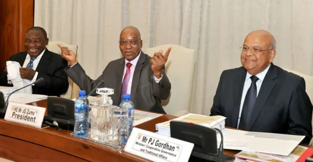 
          President Zuma (C), flanked by Pravin Gordhan (R) and Deputy President Cyril Ramaphosa (L)
        