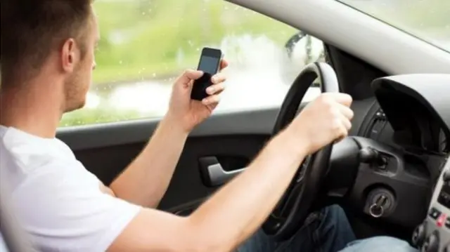 Driving whilst using a mobile phone