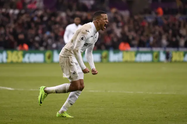 Martin Olsson celebrates his equaliser for Swansea