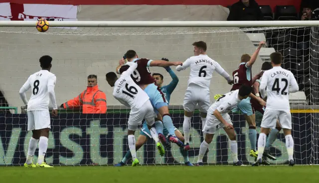 
          Sam Vokes appears to handle the ball before Burnley are awarded a penalty
        