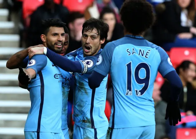 Leroy Sane and Sergio Aguero celebrate