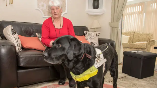 Rita Nicholls and her guide dog