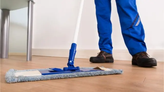 Person cleaning floor