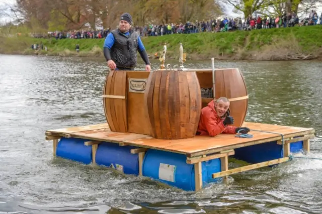 Beer raft floating down River Wye