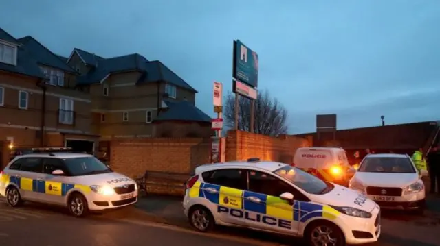 Police at the scene after a baby girl's remains were found