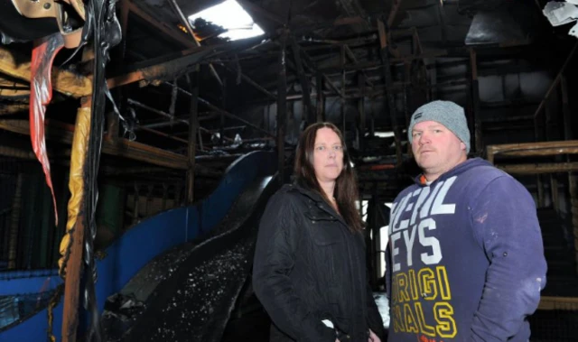 Couple in burned-out building