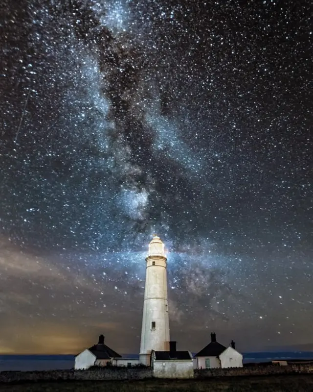 Lighthouse against the night sky