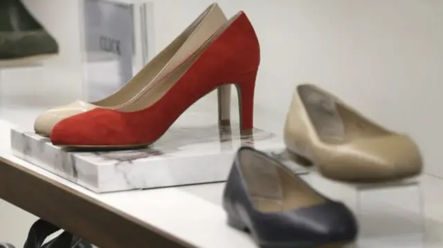 High and low heeled court shoes on a shelf