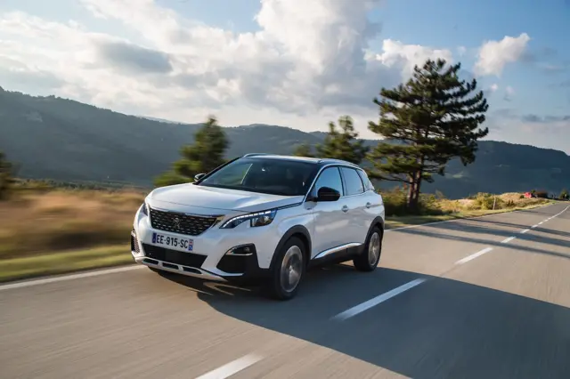 Peugeot 3008 on road in hills