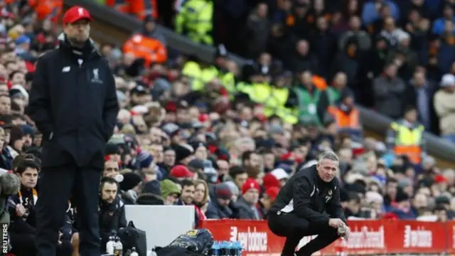 
          Lambert squats during Wolves' FA Cup fourth-round win over Jurgen Klopp's Liverpool
        