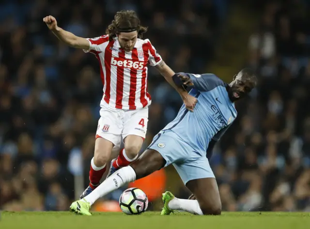 
          Manchester City"s Yaya Toure in action with Stoke City"s Joe Allen
        