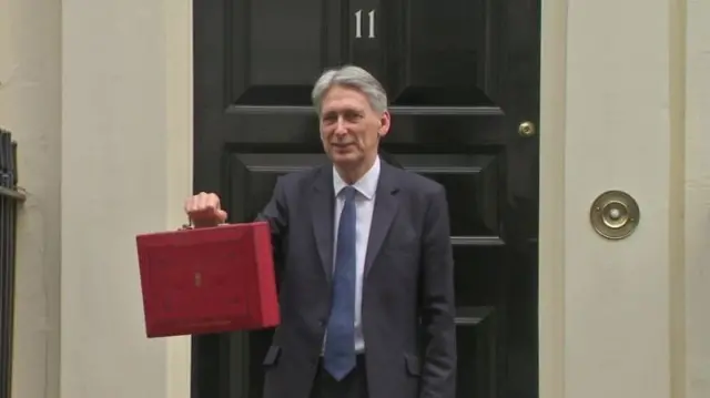 Philip Hammond with red box outside 11 Downing Street