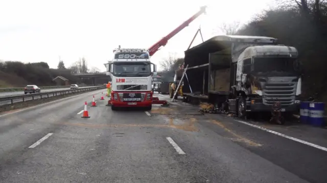 Crane lifting part of the vehicle away