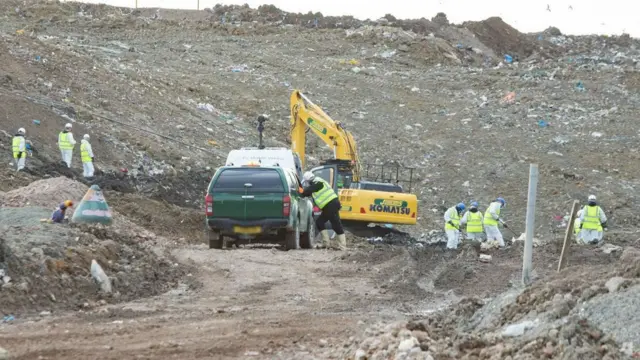 Officers searching the landfill site at Milton