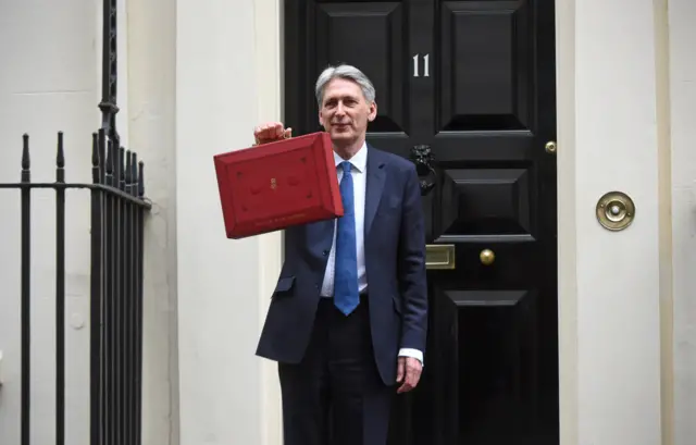 
          Budget 2017: Philip Hammond outside No 11 Downing Street holding the budget box
        