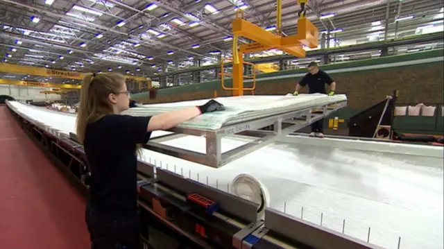 Woman in manufacturing plant