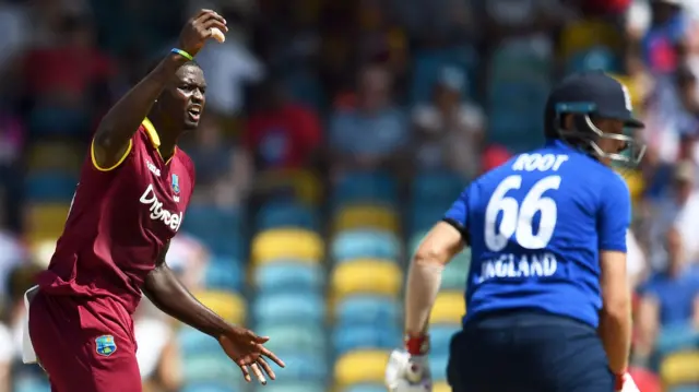 Jason Holder reacts after Joe Root is dropped