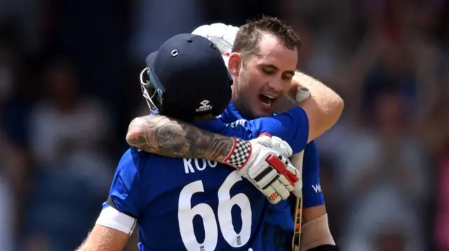 Alex Hales celebrates his century with Joe Root