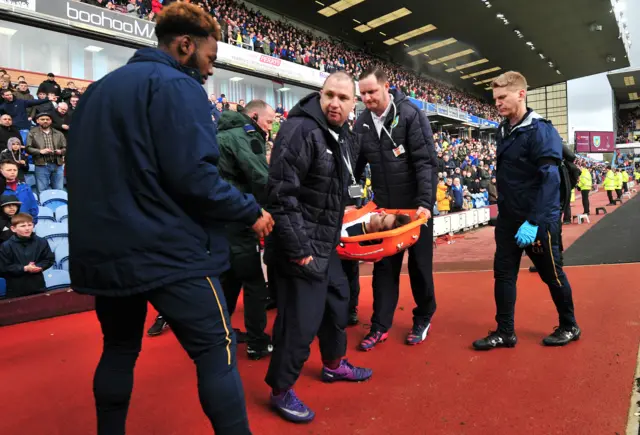 Harry Winks is stretchered off