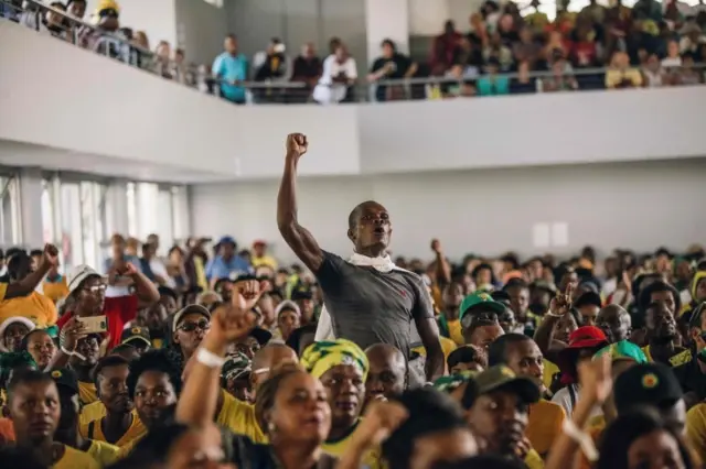 
          uth African ruling Party African National Congress Youth League member shouts in support of South African President Jacob Zuma as sacked finance minister Pravin Gordhan speaks at a memorial service held in Durban in honour of anti-apartheid icon Ahmed Kathrada on April 9, 2017 in Durban.
        