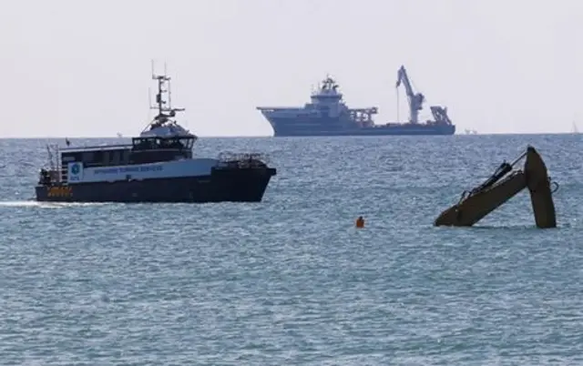 Digger stranded off Sussex coast