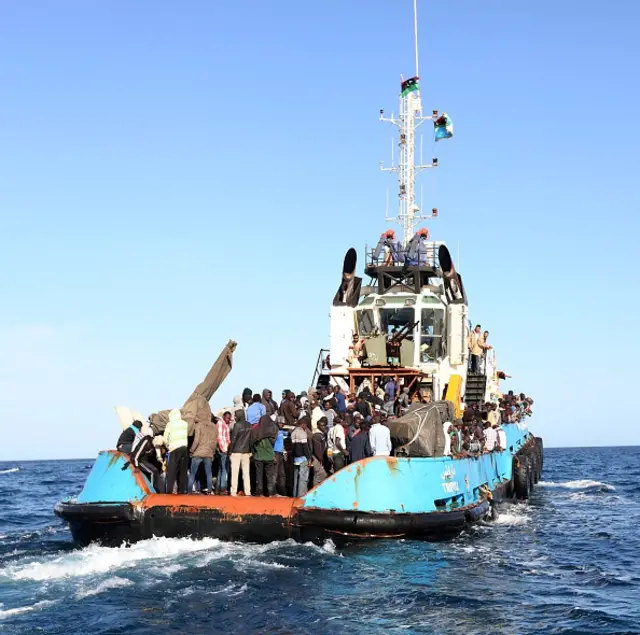 
          A Libyan coastguard boat carrying mostly African migrants prepares to dock at the port in the city of Misrata on May 3, 2015, after the coastguard intercepted five boats carrying around 500 people trying to reach Europe.
        