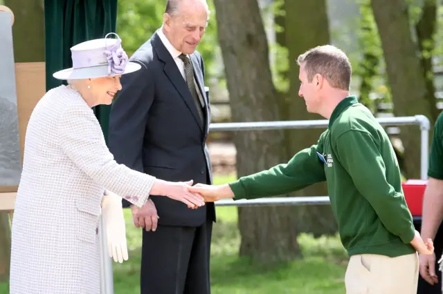 
          Queen Elizabeth II and Duke of Edinburgh meet the Head Elephant Keeper
        