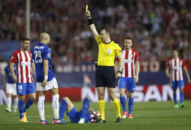 Yohan Benalouane is booked by referee Jonas Eriksson