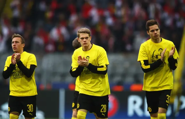 Felix Passlack (L), Matthias Ginter (C) and Julian Weigl (R) of Borussia Dortmund