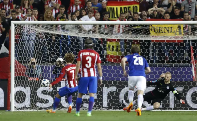 Atletico Madrid"s Antoine Griezmann scores their first goal