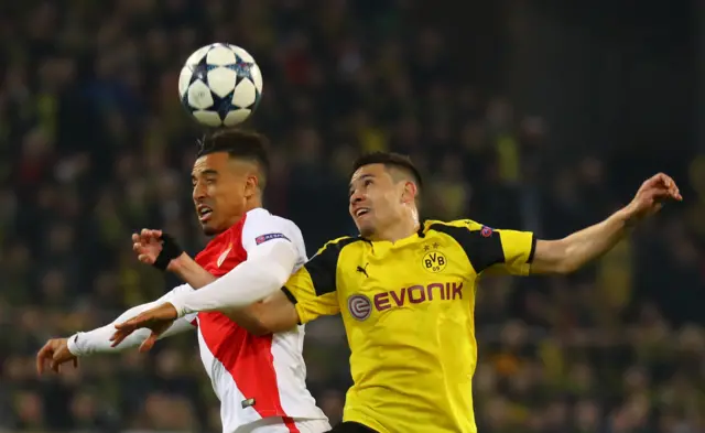 Borussia Dortmund's Raphael Guerreiro in action with Monaco's Nabil Dirar