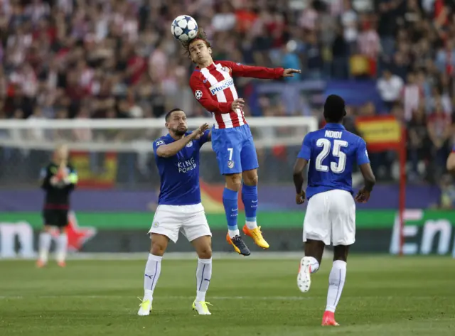 Atletico Madrid"s Antoine Griezmann in action with Leicester City"s Danny Drinkwater