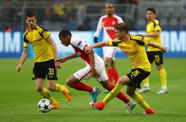 Monaco's Kylian Mbappe-Lottin in action with Borussia Dortmund's Lukasz Piszczek and Julian Weigl