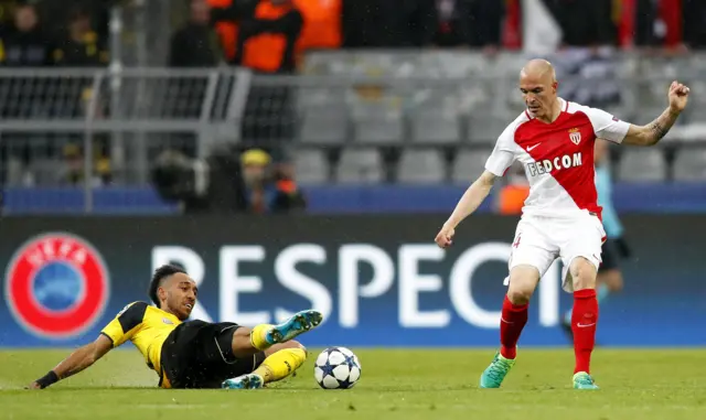 Borussia#s Pierre-Emerick Aubameyang and Monaco's Andrea Raggi vie for the ball