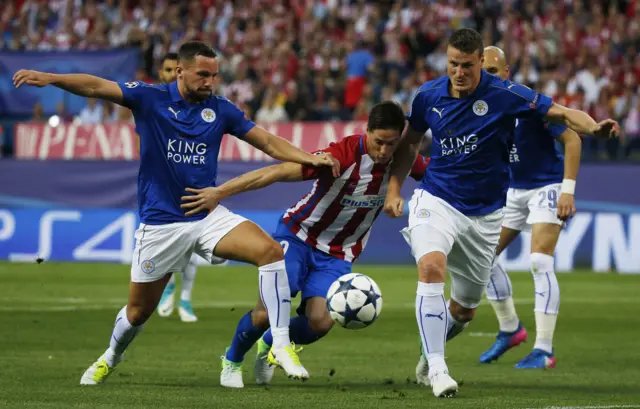 Leicester City's Danny Drinkwater and Robert Huth in action with Atletico Madrid's Fernando Torres