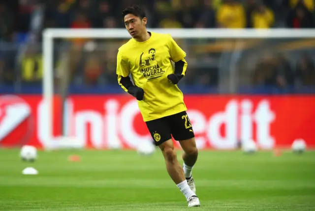 Shinji Kagawa of Borussia Dortmund wears a shirt for Marc Bartra