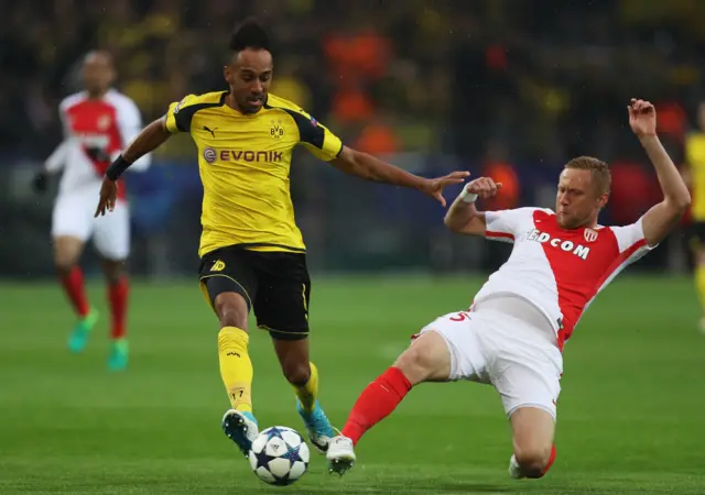 Pierre-Emerick Aubameyang of Borussia Dortmund is tackled by Kamil Glik of AS Monaco