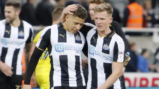 Newcastle striker Dwight Gayle (left)