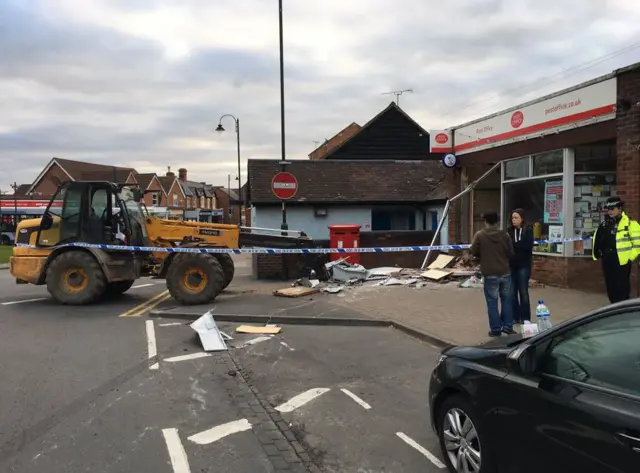 Digger in road