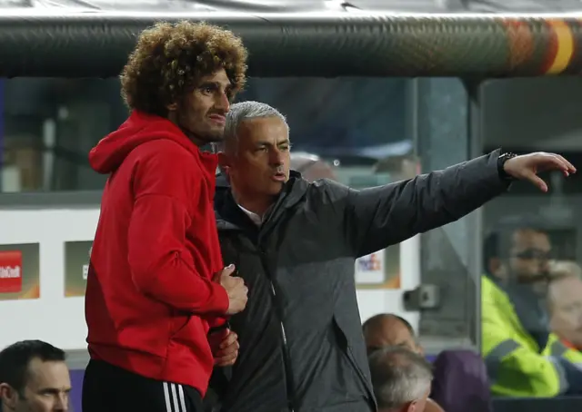 Marouane Fellaini speaks with Jose Mourinho