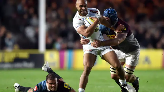 Olly Woodburn of Exeter Chiefs takes on the Harlequins defence