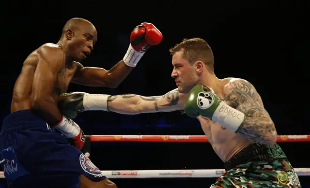 Ricky Burns reaches for Julius Indongo