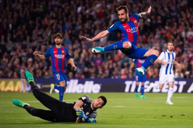 Paco Alcacer leaps over Geronimo Rulli