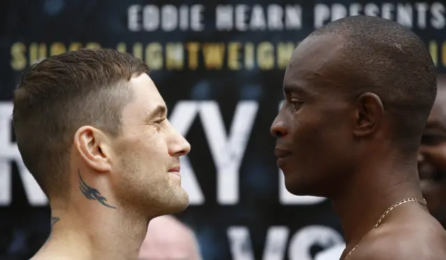 Ricky Burns smiles at Julius Indongo at the weigh-in