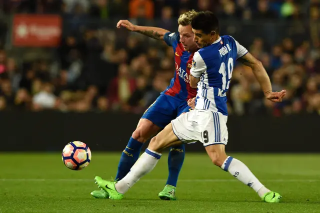 Yuri Berchiche tackles Ivan Rakitic