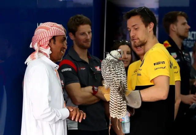 Jolyon Palmer of Great Britain and Renault Sport F1 holds a falcon