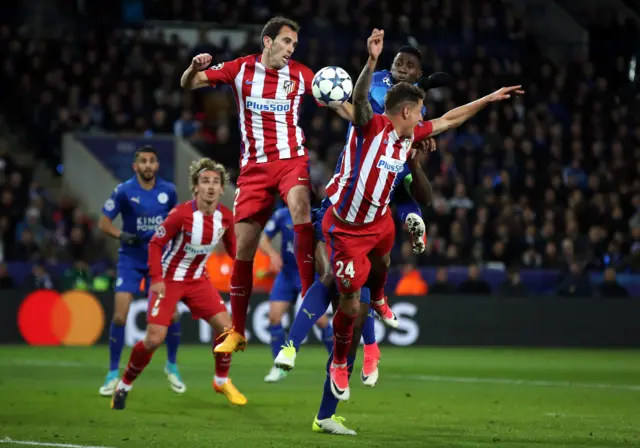 Leicester and Atletico players fight for the ball