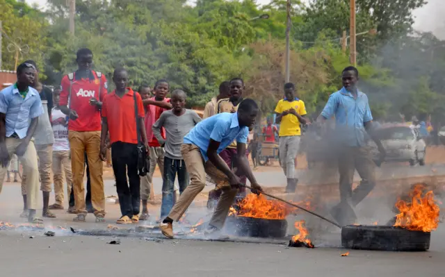 Students burn tyres during a protest in Niamey