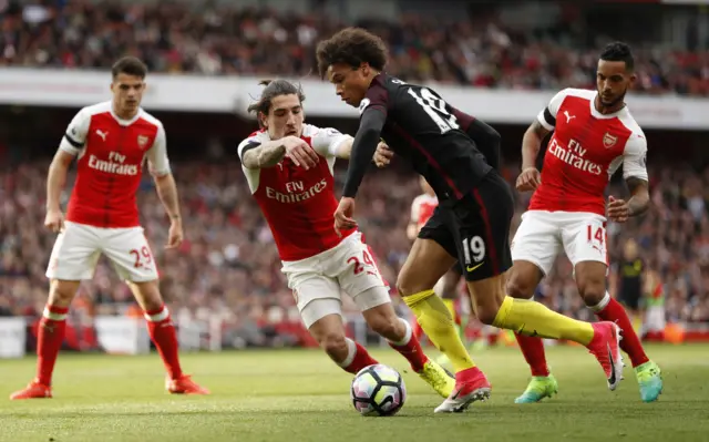 Leroy Sane runs at Hector Bellerin